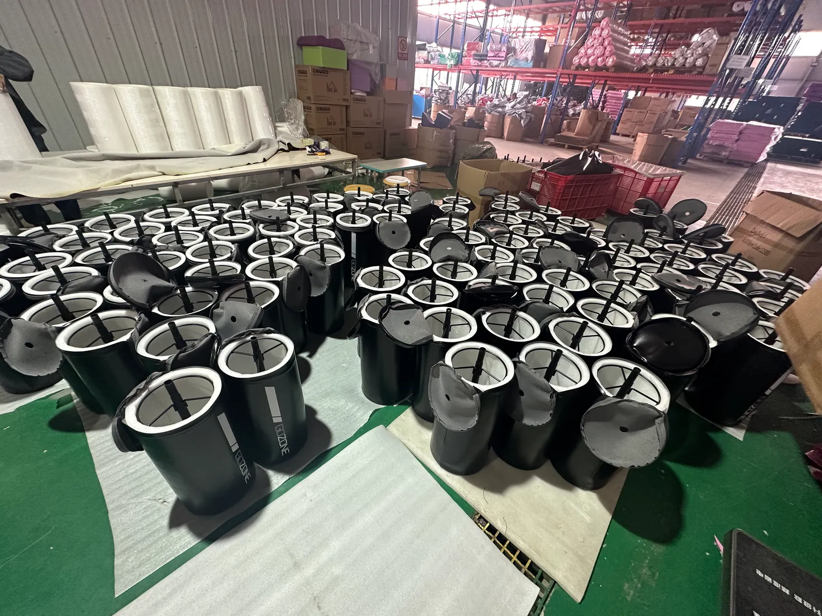 Soft training product covers in assembly on the workshop floor